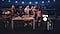 People are having a party on the rooftop with Sound Tower. Built-in battery signifies Sound Tower can last for 12 hours.