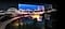 A city lit up by bright lights is on display. The colors and lights are vivid as OLED lights portray through the QD screen.