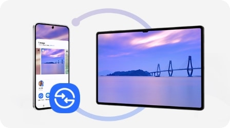 Un smartphone affichant un processus de transfert de photos vers une tablette. L&rsquo;&eacute;cran affiche l&rsquo;image d&rsquo;une vue pittoresque partag&eacute;e entre les appareils.