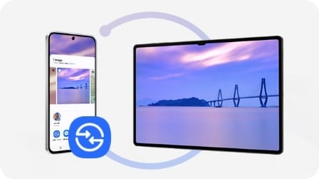 Un smartphone affichant un processus de transfert de photos vers une tablette. L&rsquo;&eacute;cran affiche l&rsquo;image d&rsquo;une vue pittoresque partag&eacute;e entre les appareils.