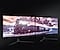 Two monitors are shown side-by-side projecting a cohesive scene of a steam train driving through the snow. The bezels between the left and right monitors are very thin compared to the overall picture, providing the same impression as a single ultra-wide monitor.
