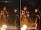 The same image of Crimson Desert with two men in cloaks around a campfire is shown twice in comparison. On the right, the image labeled "Odyssey OLED G6," the blacks are much darker than the left image labeled "Samsung Conventional Monitor."