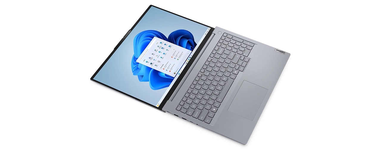 Vue plongeante en biais de l’ordinateur portable Lenovo ThinkBook 16 Gen 8 (16 pouces Intel) ouvert à 180 degrés, illustrant son design flexible, son large écran et son clavier étendu pour une productivité accrue.