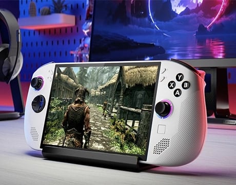 Lenovo Legion Go S Gen 1 (8") gaming handheld on a desk stand displaying an open-world RPG game.