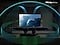In a living room, a couple sits on a sofa and watches TV. The TV&rsquo;s front speakers are lit up and soundwaves emanate from a TV&rsquo;s side and up-firing speakers, travelling in multiple directions to surround the couple in a dome of sound and fill the room. Dolby Atmos logo.
