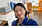 Person in a showroom, smiling. The person turns and grabs a cup from a shelf. The person turns back to face the front, smiling with the cup next to the face. At the bottom is camera icon with text Captured by Galaxy A56 5G hashtag with Galaxy.