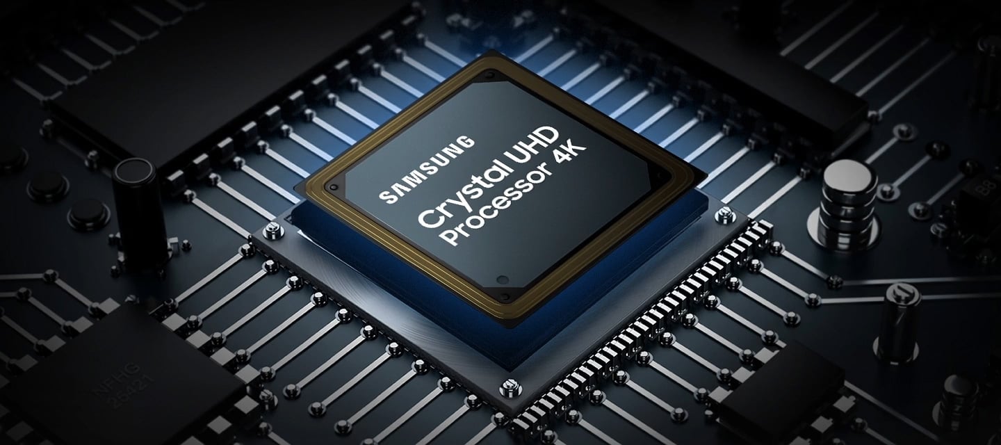 A Samsung Crystal UHD Processor 4K chip is laid out on a TV's main board with glowing power lines.