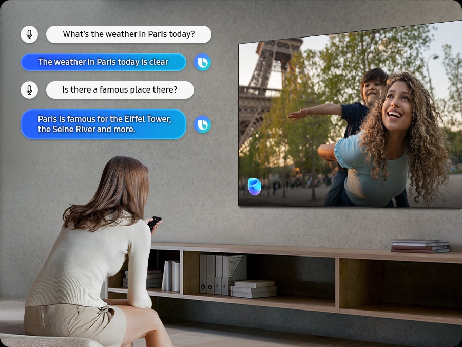 Woman in living room speaks to Bixby through the TV. Captions of the dialogue are shown. What&rsquo;s the weather in Paris today? The weather in Paris today is clear. Is there a famous place there? Paris is famous for the Eiffel Tower, the Seine River and more.