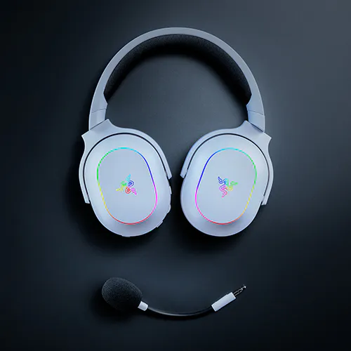 Over-ear gaming headset with &Eacute;CLAIRAGE RGB, logo on ear cups, and attached microphone, placed on a dark background.
