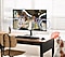 A modern monitor setup and a dog. Active Voice Amplifier enhances Dialogue sound when the dog barks.
