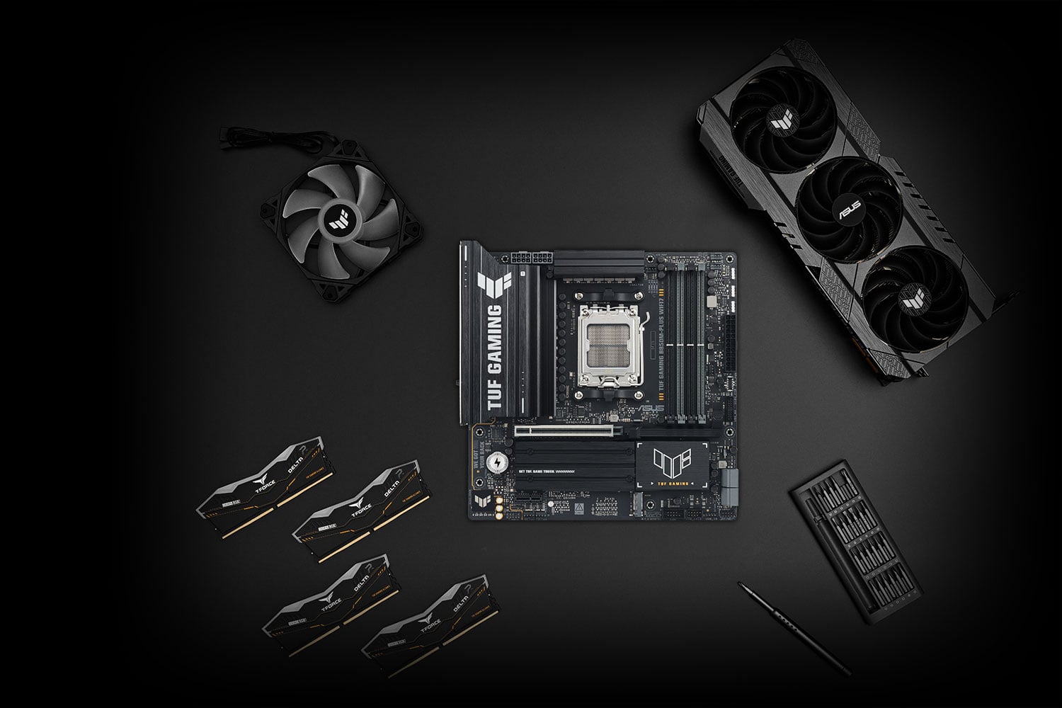 TUF GAMING B850M-PLUS WIFI7 motherboard placed on a metallic surface with various compatible PC components, including M.2 SSDs and memory modules, arranged neatly around it, representing the TUF Gaming Alliance for guaranteed build compatibility.